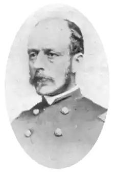 Colonel Frank Haskell in a military uniform. Appears to be in mid 50s with baldking har and mustache.