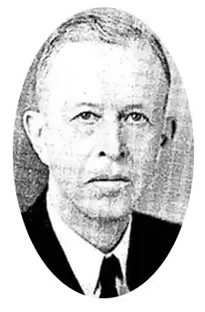 Henry Gunderson - male in mid 50s early 60s. Slender with thin hair, thin face and cleanly shaven.